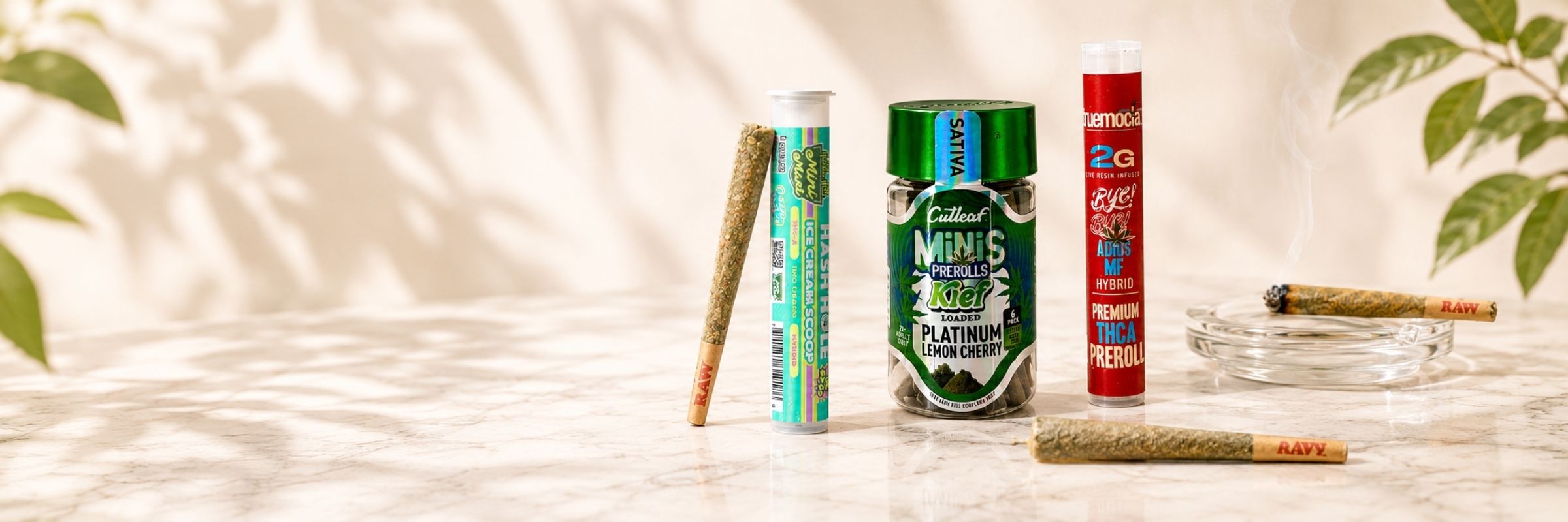 THCA pre-roll collection featuring Cutleaf mini pre-rolls, premium pre-roll tubes, and hemp flower joints on a marble surface