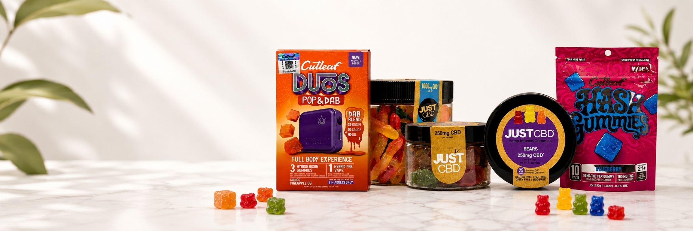 CBD gummies and edibles collection featuring JustCBD gummy jars, Cutleaf gummies